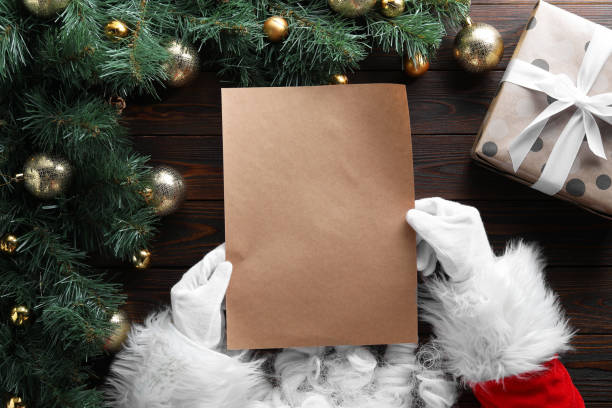 istock Santa Claus with letter at wooden table, top view. Space for text 1806284066