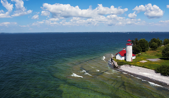 Aerial drone photograph of Nine Mile Point Lighthouse on Simcoe Island in Kingston