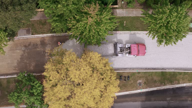 Aerial view over road construction in suburbs. Top down shot