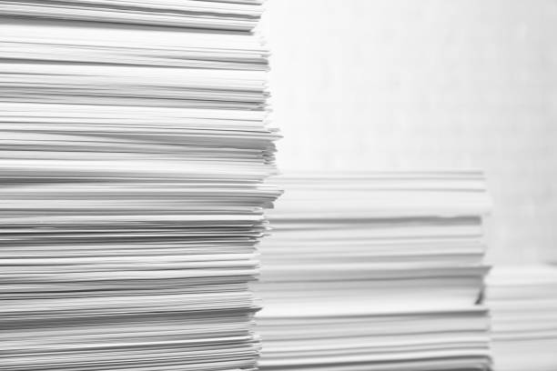 istock Stacks of paper sheets on white background, space for text 1806306855