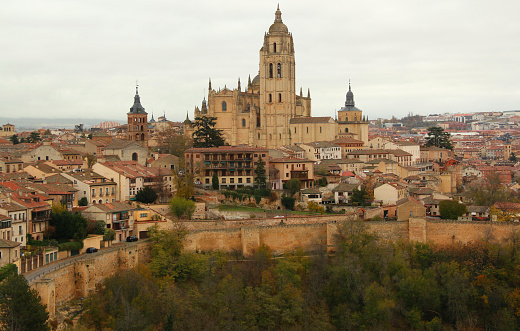 Panoramic view of the historic part of the city surrounded by medieval walls with the Cathedral in the center of the photo in the city of Segovia, near Madrid