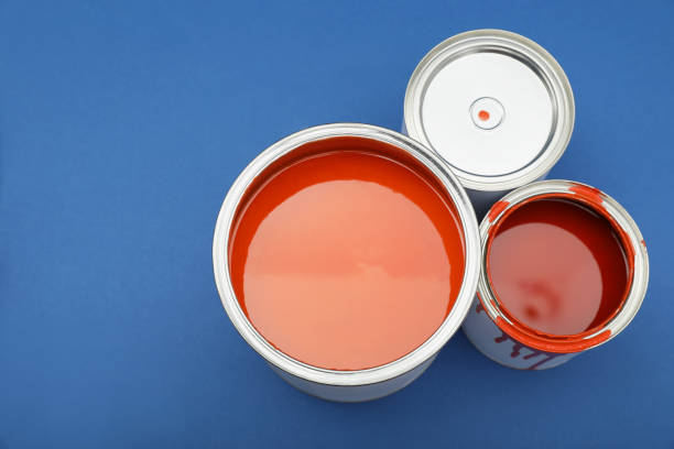 istock Cans of orange paint on blue background, flat lay. Space for text 1806325779