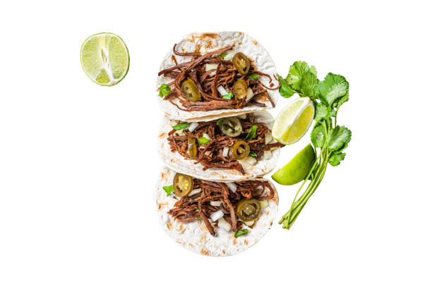 istock Mexican Beef Barbacoa Tacos with Cilantro and Onion.  Isolated, white background. 1806344453