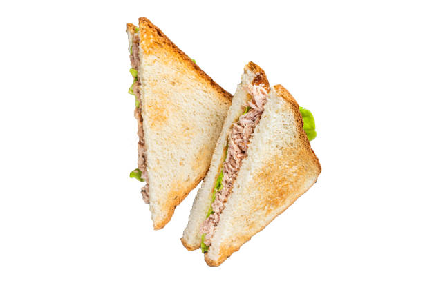 istock Tuna Salad Sandwich with Cheese, lettuce and herbs.  Isolated, white background. 1806345061