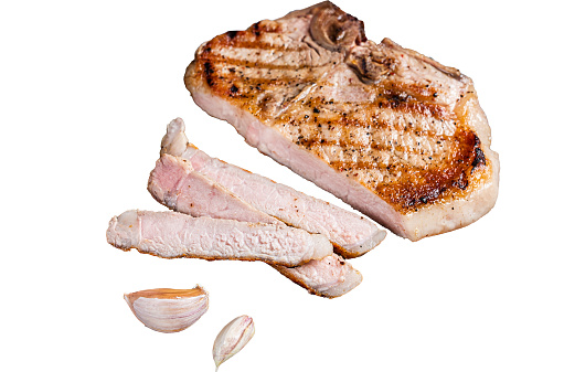 Grilled pork Chop or T-bone meat steak sliced on a wooden board.  Isolated, white background