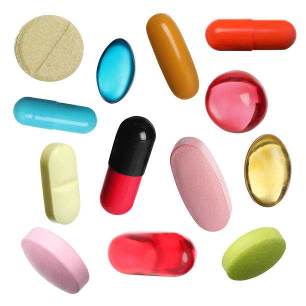 istock Many pills in different forms and colors isolated on white, collection 1806346234