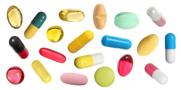 istock Many pills in different forms and colors isolated on white, collection 1806346773