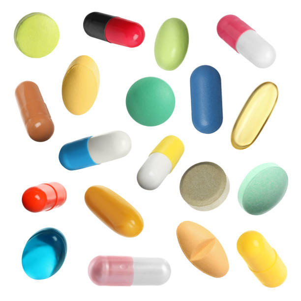 istock Many pills in different forms and colors isolated on white, collection 1806346774