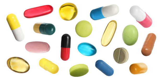 istock Many pills in different forms and colors isolated on white, collection 1806346779