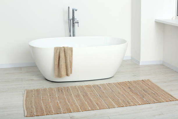 istock Beautiful white tub with towel in bathroom. Interior design 1806360220