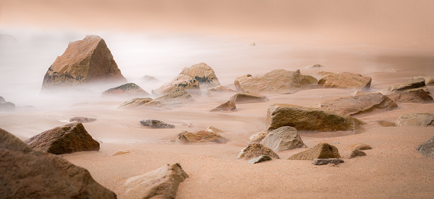 Relaxed rock landscape with sea mist. Lloret de Mar, Costa Brava, Spain. Long exposure, silk effect and movement.