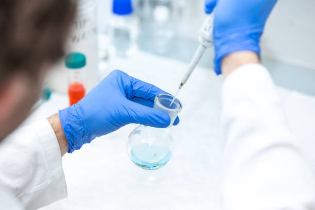 istock Young woman scientist in a research laboratory creating a scientific experiment, laboratory concept 1806364972