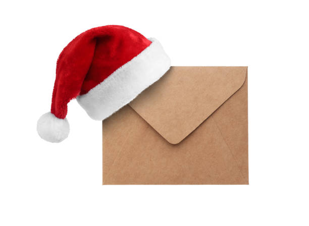 istock Letter for Santa. Red hat and envelope on white background 1806375284