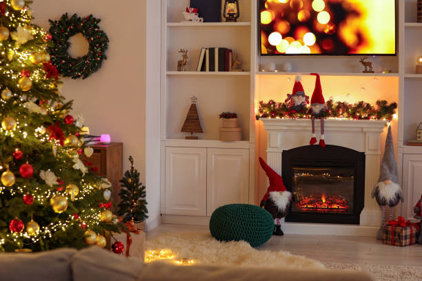 istock Living room with fireplace and Christmas decorations. Festive interior design 1806376877