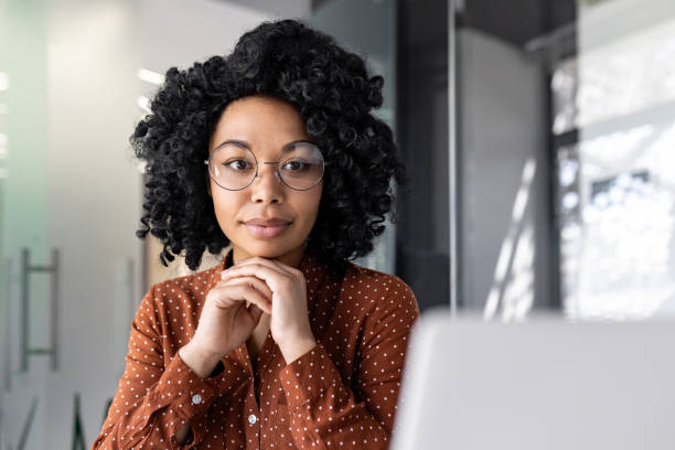 istock Serious thinking woman working with laptop, typing on keyboard, thinking concentratedly about solving current problems, business woman successful satisfied and confident at workplace inside office 1806378512