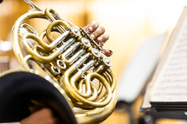 istock French horn instrument, hands playing horn player in philharmonic orchestra 1806380123
