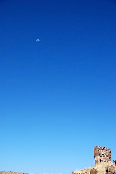 moon over sillustani 1 stock photo