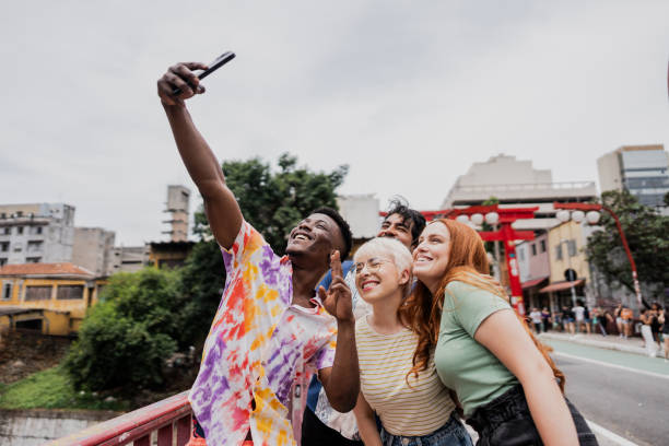 istock Traveler friends taking a selfie using a mobile phone at oriental district 1806386621