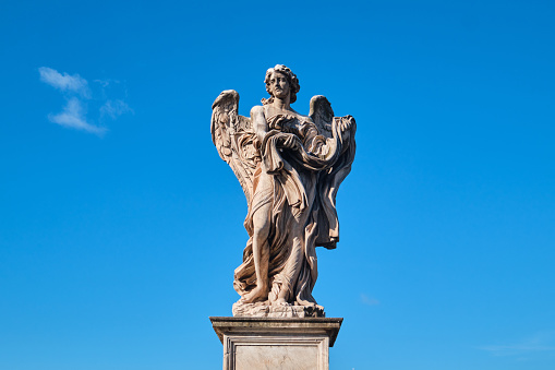 Rome, Italy - November 4 2023: One of the Angels on the Ponte Sant Angelo Bridge Designed by Bernini and completed in 134 AD