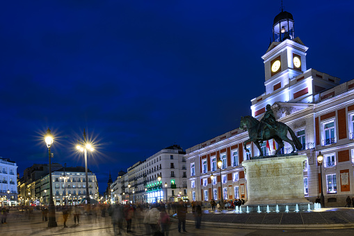 Puerta del Sol, a famous and bustling public square in Madrid, at night. Long exposure.