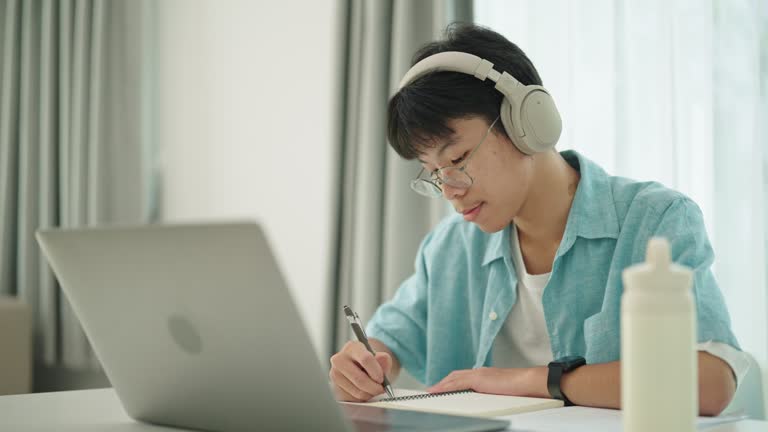 Young man online learning at home.