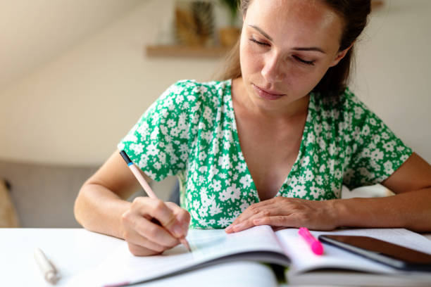 istock Adult student woman doing homework. Self-development. 1806448507