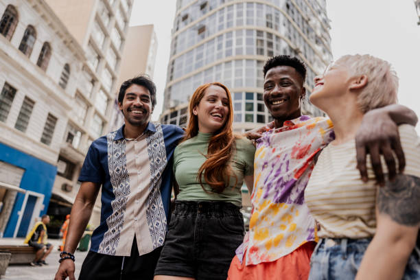 istock Friends talking while walking through the city 1806459489
