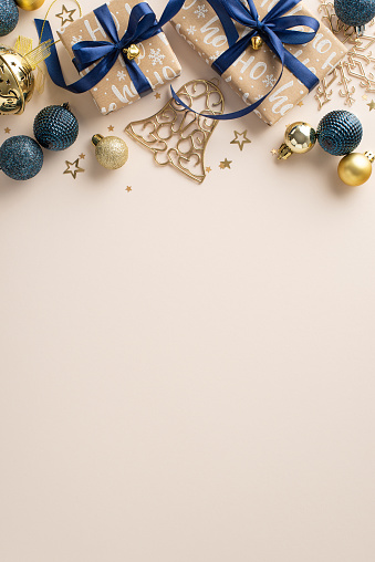 Unwrap the magic of New Year's delights. Vertical top view showcasing stylish gift parcels, lavish trinkets, starry confetti, tinkling bell on a muted beige surface, perfect for personalized greetings