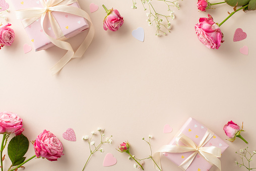 Sweet Affection Snapshot: Top view of Valentine's charmâgift boxes, pink roses, gypsophila, heart-shaped confettiâall on a pastel beige surface, inviting your personal touch
