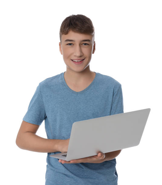 istock Teenage boy using laptop on white background 1806480660