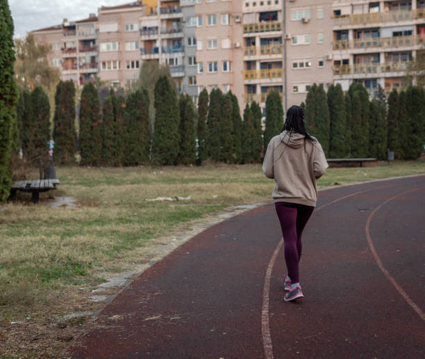 istock Female amateur runner on a track 1806486093