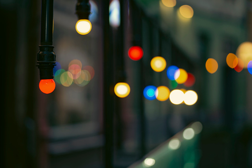 Colourful light bulbs spotlights on a dark background night decoration