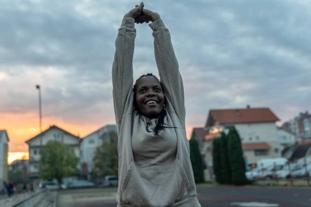 istock Woman exercising at dusk 1806497542