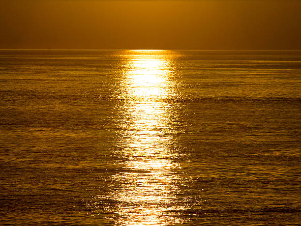 istock Sunrise and sunshine over sea 180650074