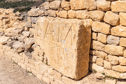 Dougga, Beja, Tunisia. An inscribed stone at the Roman ruins. in Dougga.