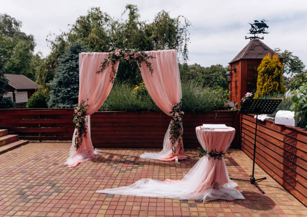 istock Wedding archway with flowers arranged in park for a wedding ceremony 1806524743