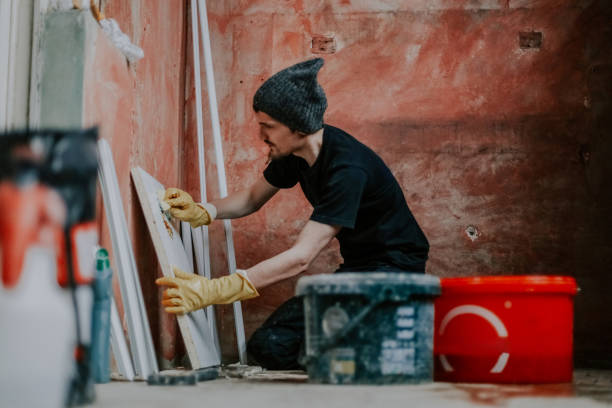 istock A young man washes the window part of the board. 1806569813