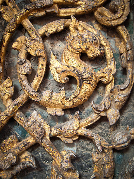 istock Dragon carved on wooden door 180657259