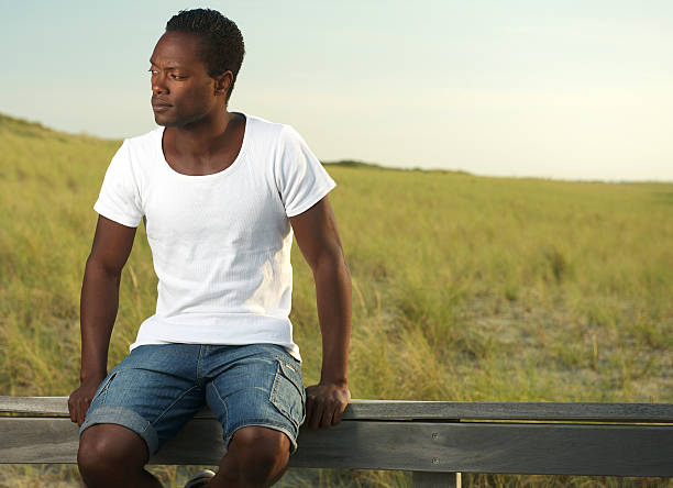 istock Attractive young man relaxing outdoors 180657542