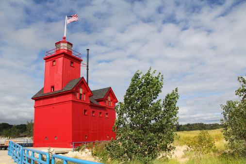 Big Red Lighthouse on the beach in Holland Michigan with copy space.