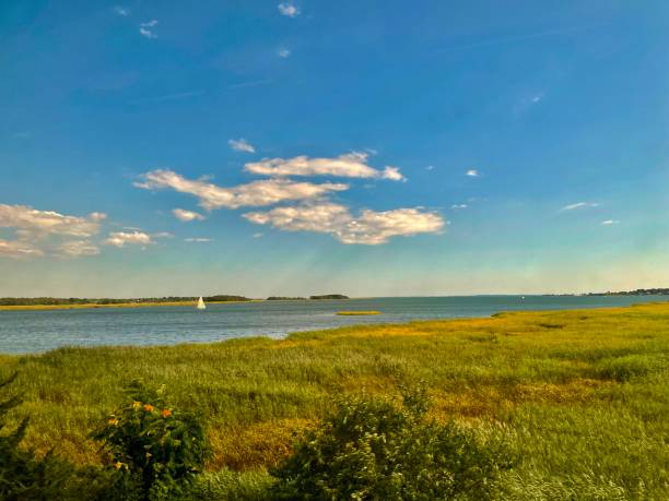 Travelling by train along the shoreline, from Boston to Old Saybrook, in summertime. The Connecticut River starts in the New Hampshire mountains, and then flows southward for more than 400 miles to the point where it empties into Long Island Sound at the town of Old Saybrook.
