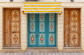 A colorful door on a building in the city of Kairouan.