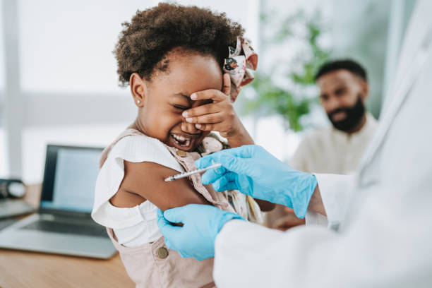istock Scared and crying child being vaccinated 1806605915