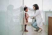Child at doctor's appointment measuring height