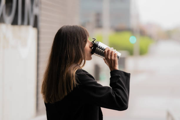 istock Girl Savoring Coffee in Thermos 1806618368