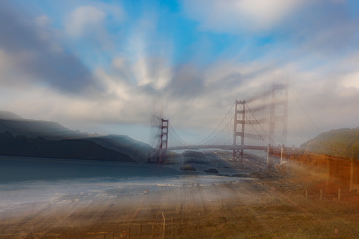 San Francisco's iconic Golden Gate Bridge shown in a unique abstraction by zooming the lens during exposure.