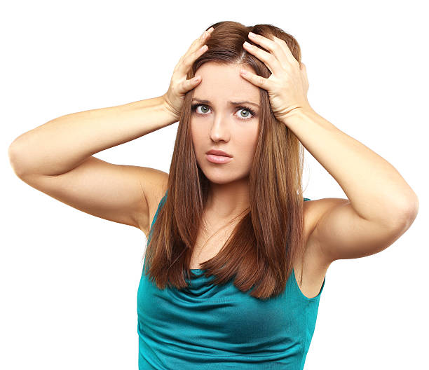 istock Problem.Portrait of young woman suffering from headache 180665684