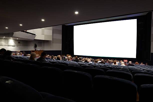 istock Cinema auditorium with people. 180665928