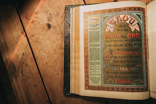 An antique copy of the Hebrew scriptures and New Testament Bible from the 1800's.  Detail shot of the ten commandments as given to Moses on Mount Sinai.