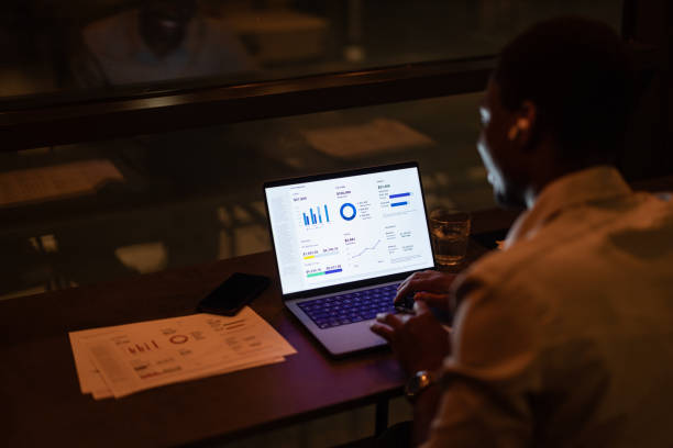 istock Unrecognizable Businessman Working Late At Night On His Laptop Computer 1806693650